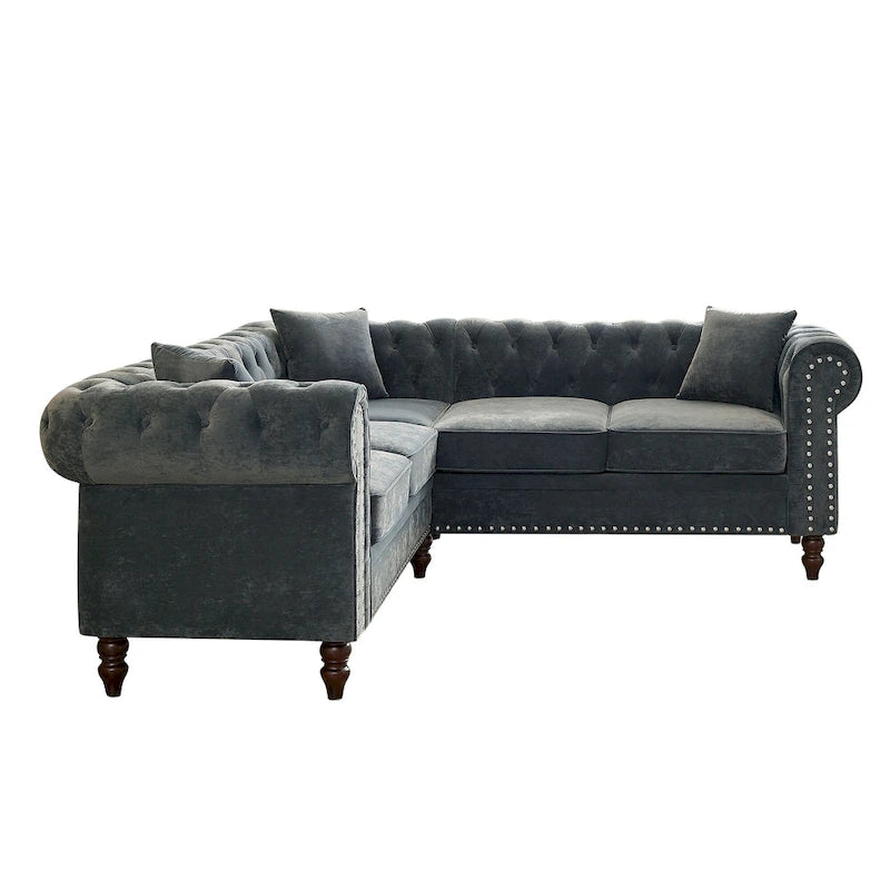 L-förmiges Sofa mit tief gehefteten Details und geschwungenen Armlehnen.